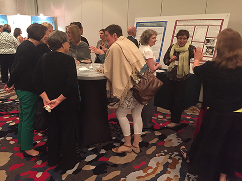 2016 CMV Conference Reception, attendees networking and discussing posters